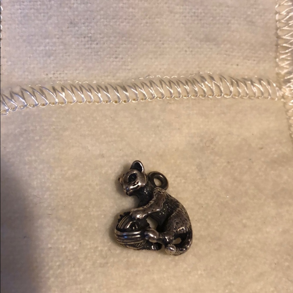 Retired piece, Cat with yarn. James Avery